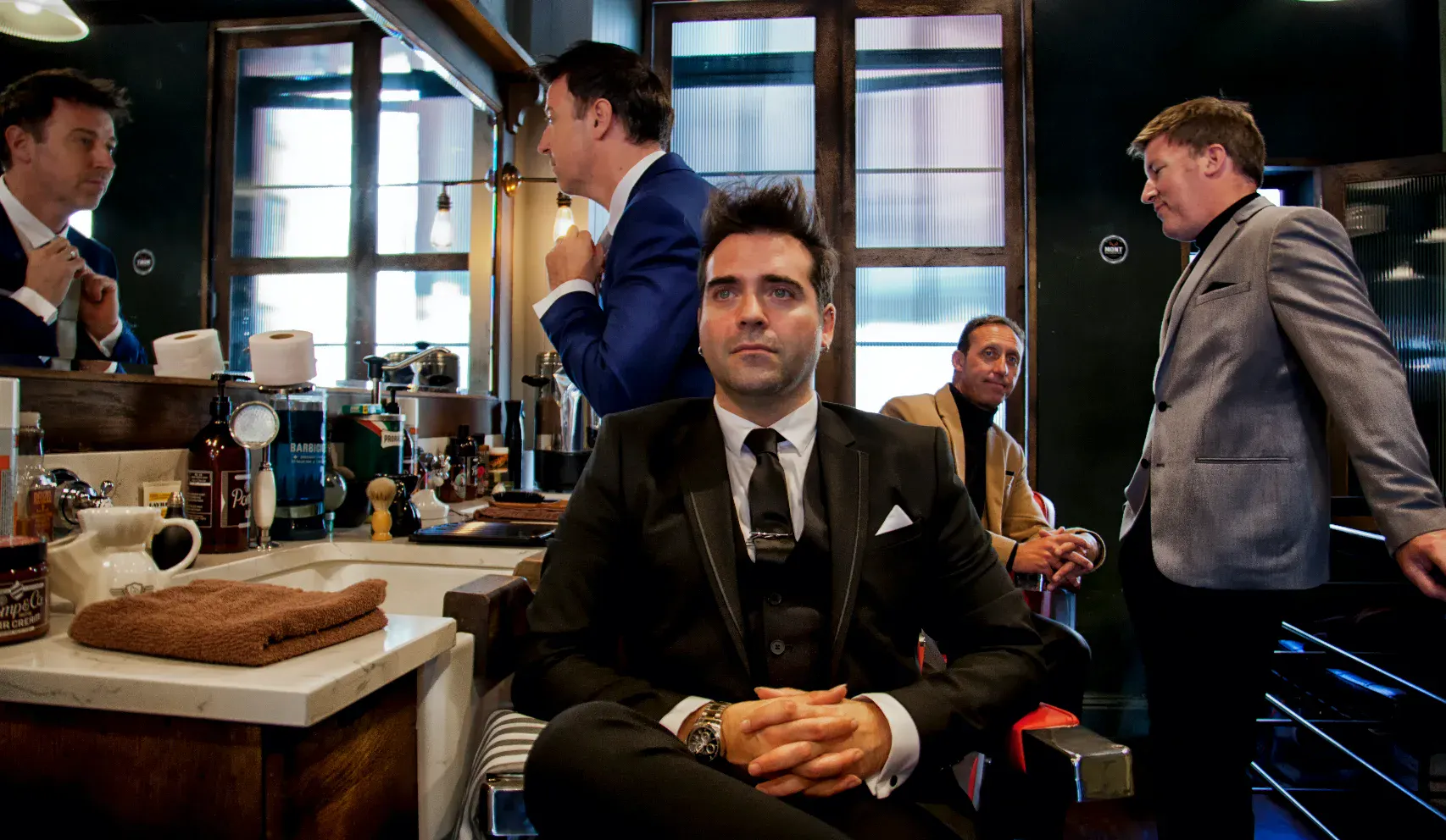 Sway Social band in a barbershop
